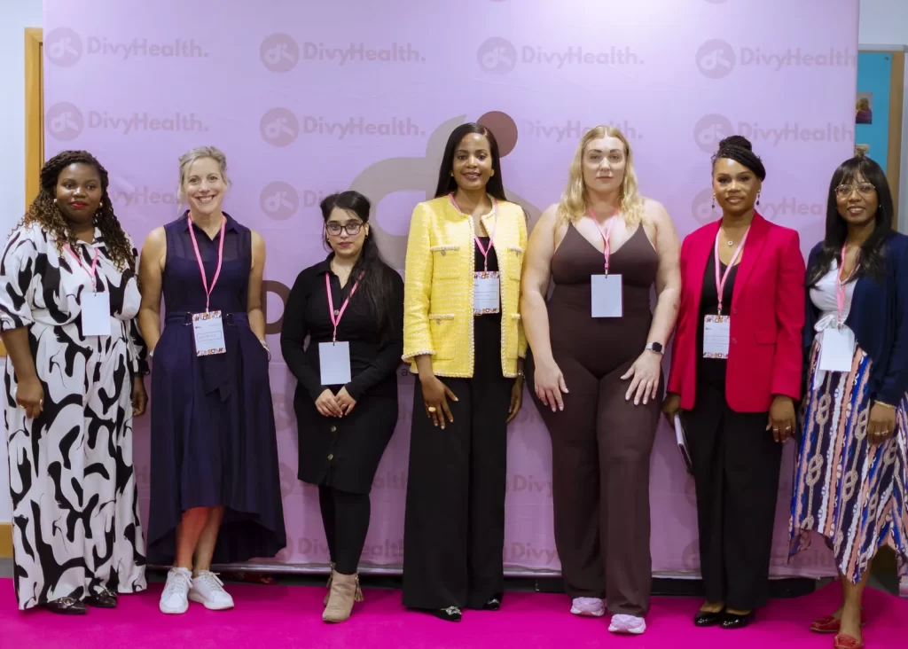 Speakers and organisers at the Women’s Health Action Summit backdrop